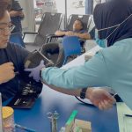Mr. Calvin is having his blood pressure checked before donating blood.